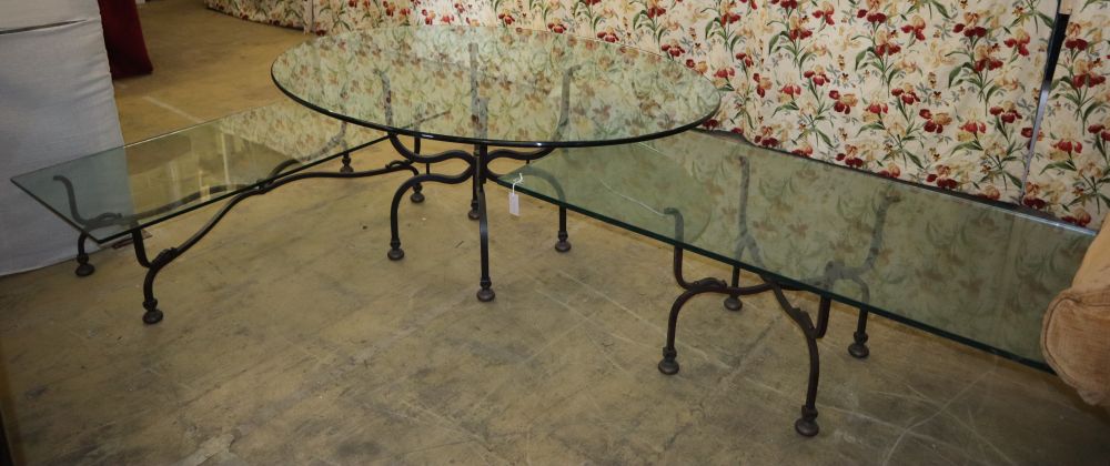 Three wrought iron glass top tables, largest W.150cm, D.76cm, H.56cm